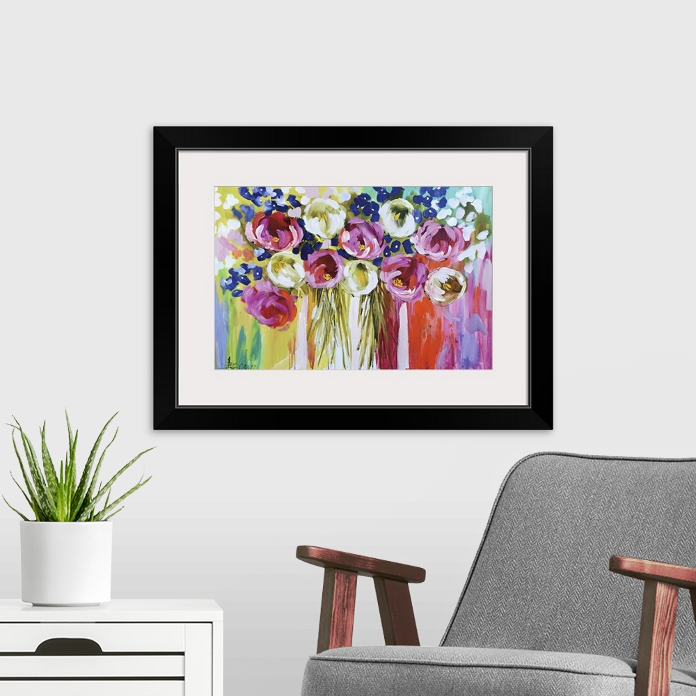 A modern room featuring A colorful contemporary painting of a group of flowers on a multi-colored background.