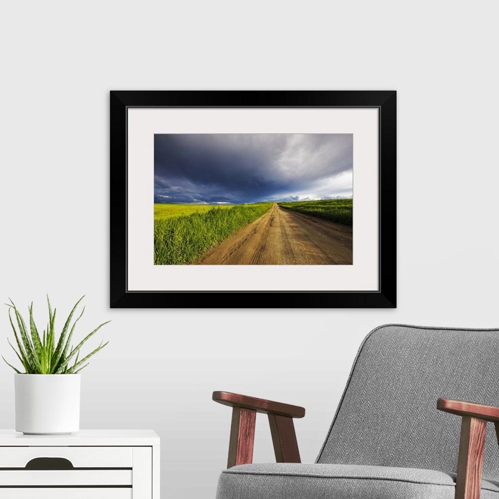 A modern room featuring Storm clouds over West Spring Creek Road in the Flathead Valley, Montana, USA.