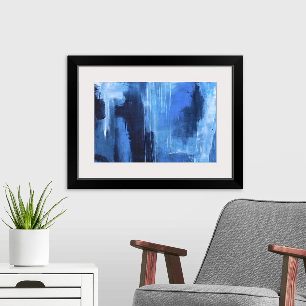 A modern room featuring Large abstract painting created with shades of blue and dripping white paint.