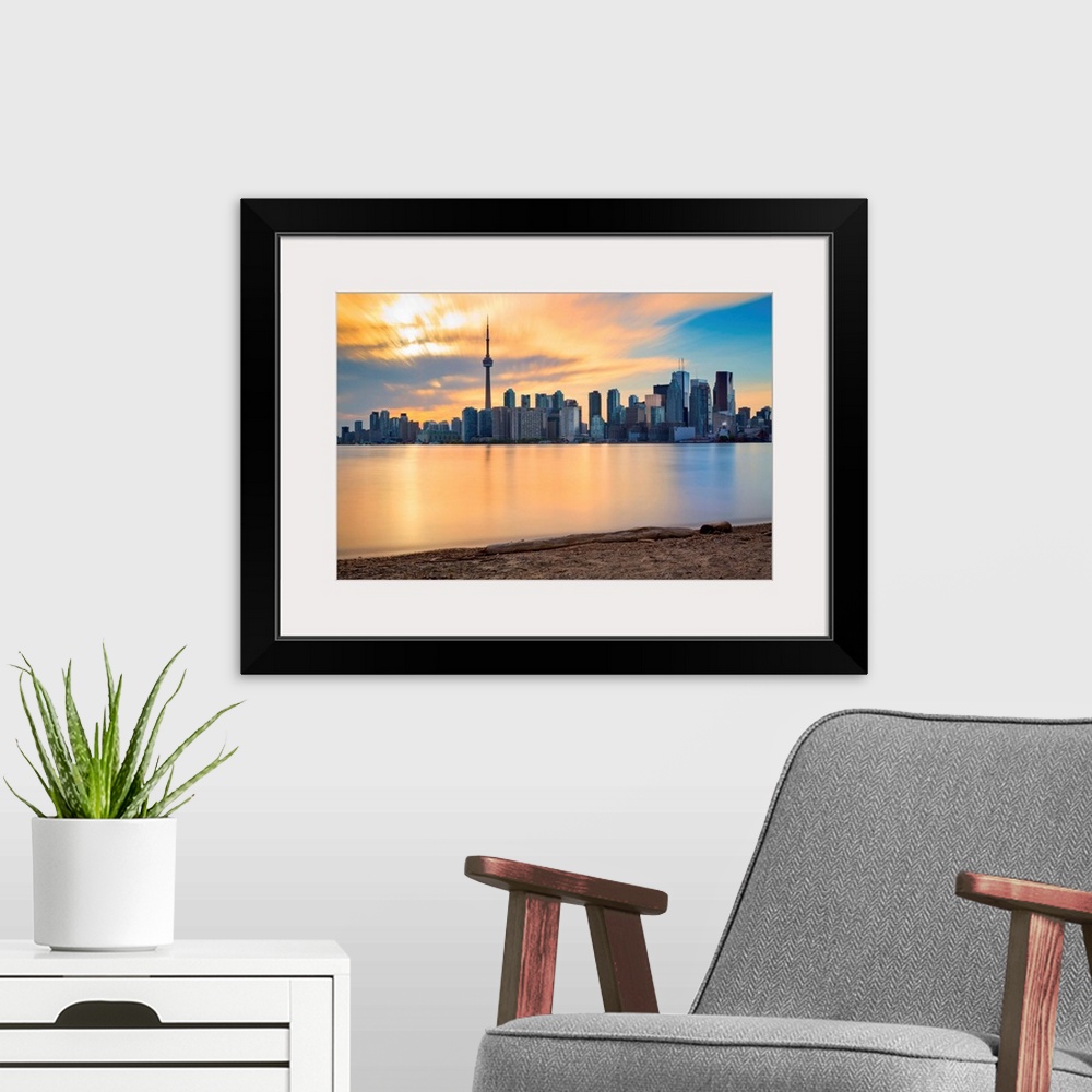A modern room featuring Canada, Ontario, Toronto, Skyline at sunset.