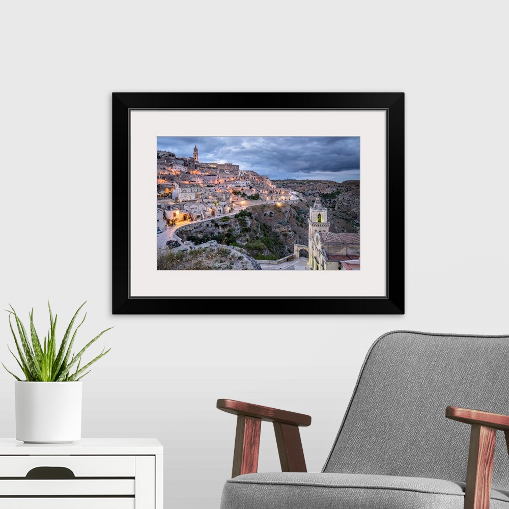 A modern room featuring Italy, Basilicata, Matera, Sasso Barisano view from Sasso Caveoso and, in the foreground, the pop...