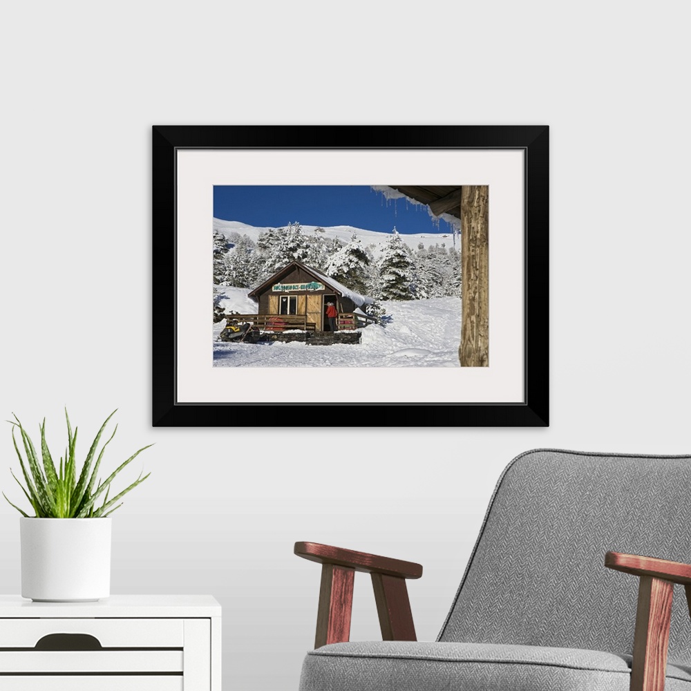 A modern room featuring Italy, Sicily, Mount Etna, chalet for renting wintersport equipment