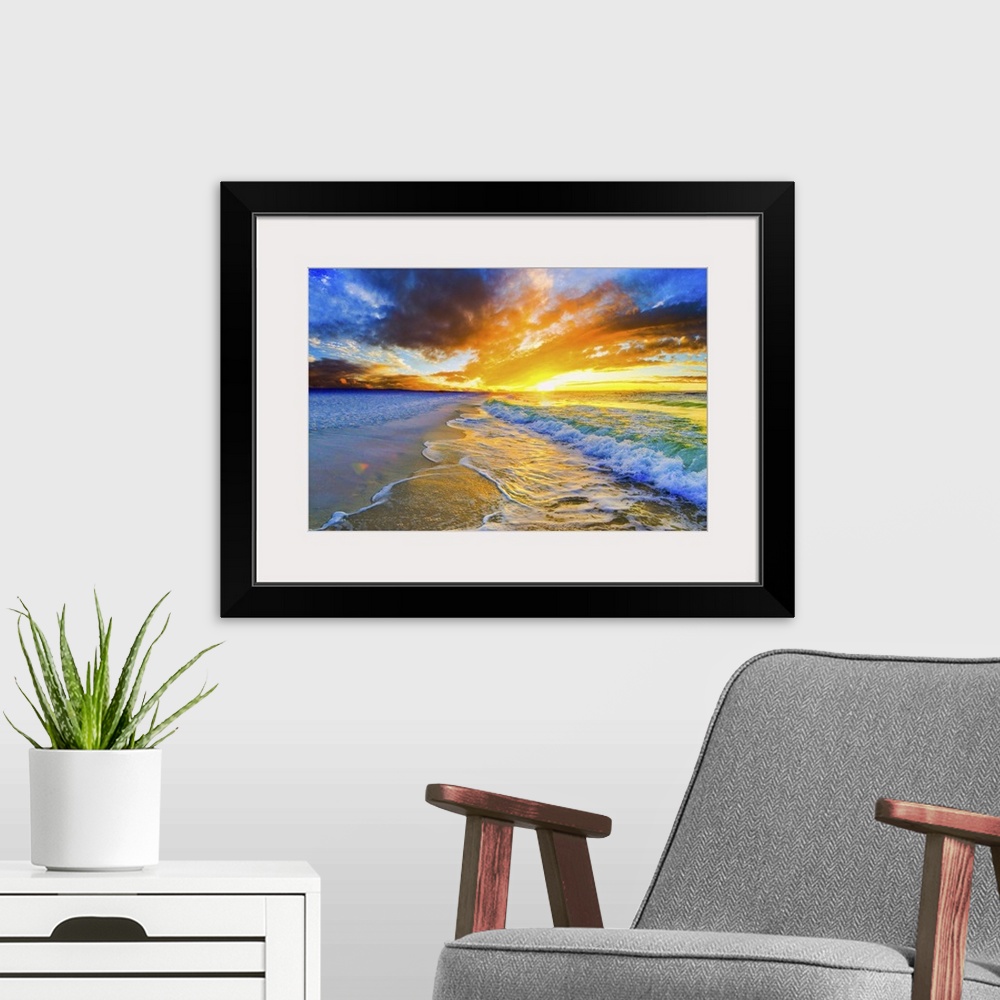 A modern room featuring A bright orange and blue sunset over a beautiful beach. Green and gold ocean waves roll across th...