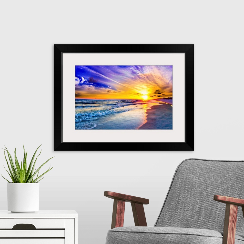 A modern room featuring An amazing sunset with pink and purple sky and clouds. A blue seascape and beach below.