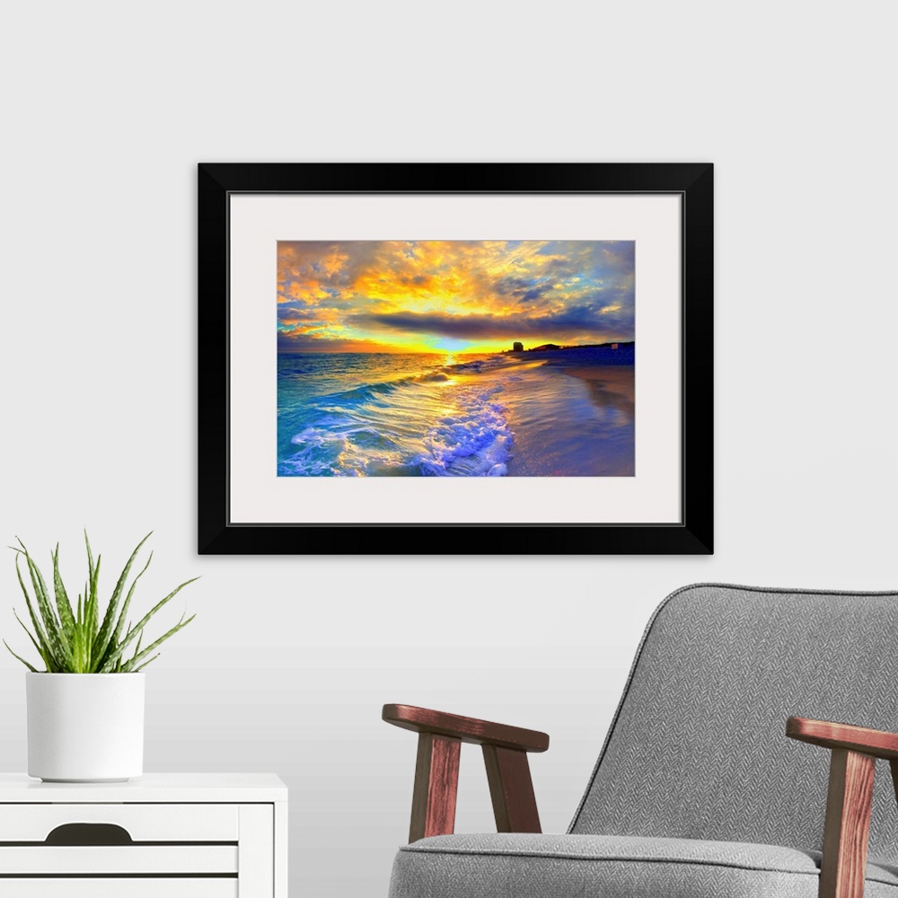 A modern room featuring A beautiful yellow sunrise with foaming ocean waves striking the beach. Yellow clouds burst into ...