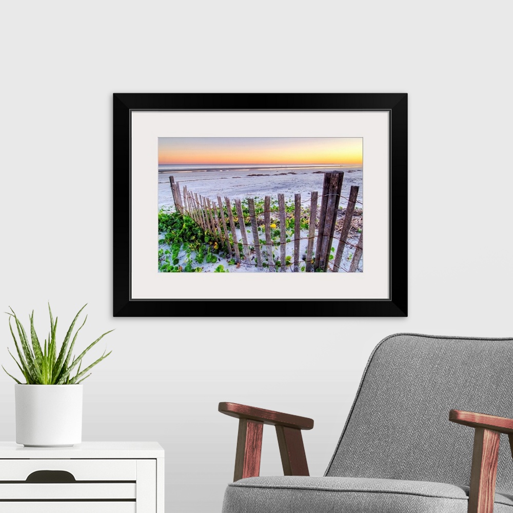A modern room featuring Wall art for the home or office this landscape photograph is of a battered barrier fence ends on ...
