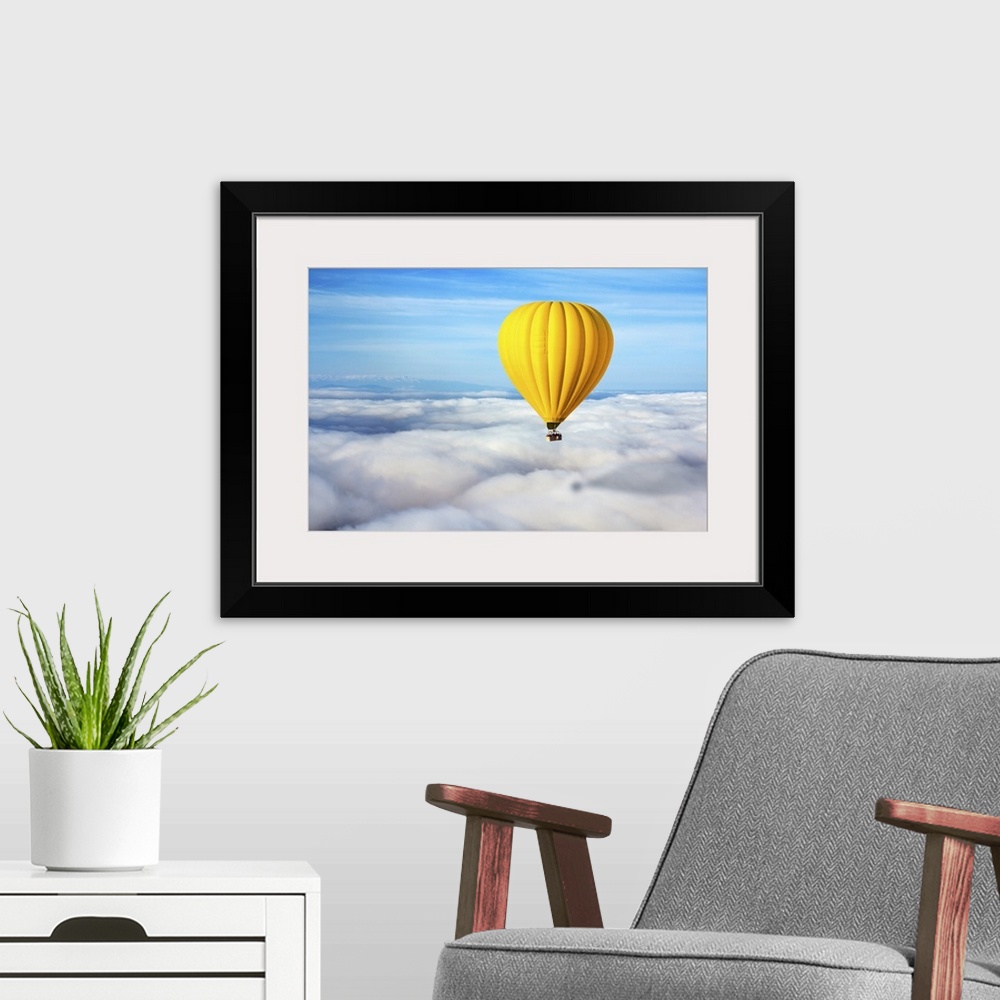 A modern room featuring A Lonely Yellow Hot Air Balloon Floats Above The Clouds