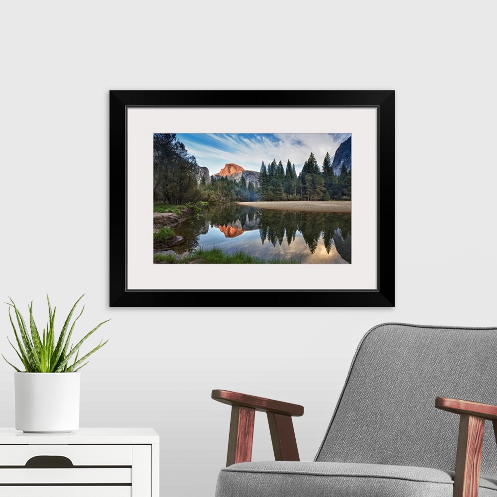 A modern room featuring Half Dome reflecting in  Merced river in Yosemite National Park.