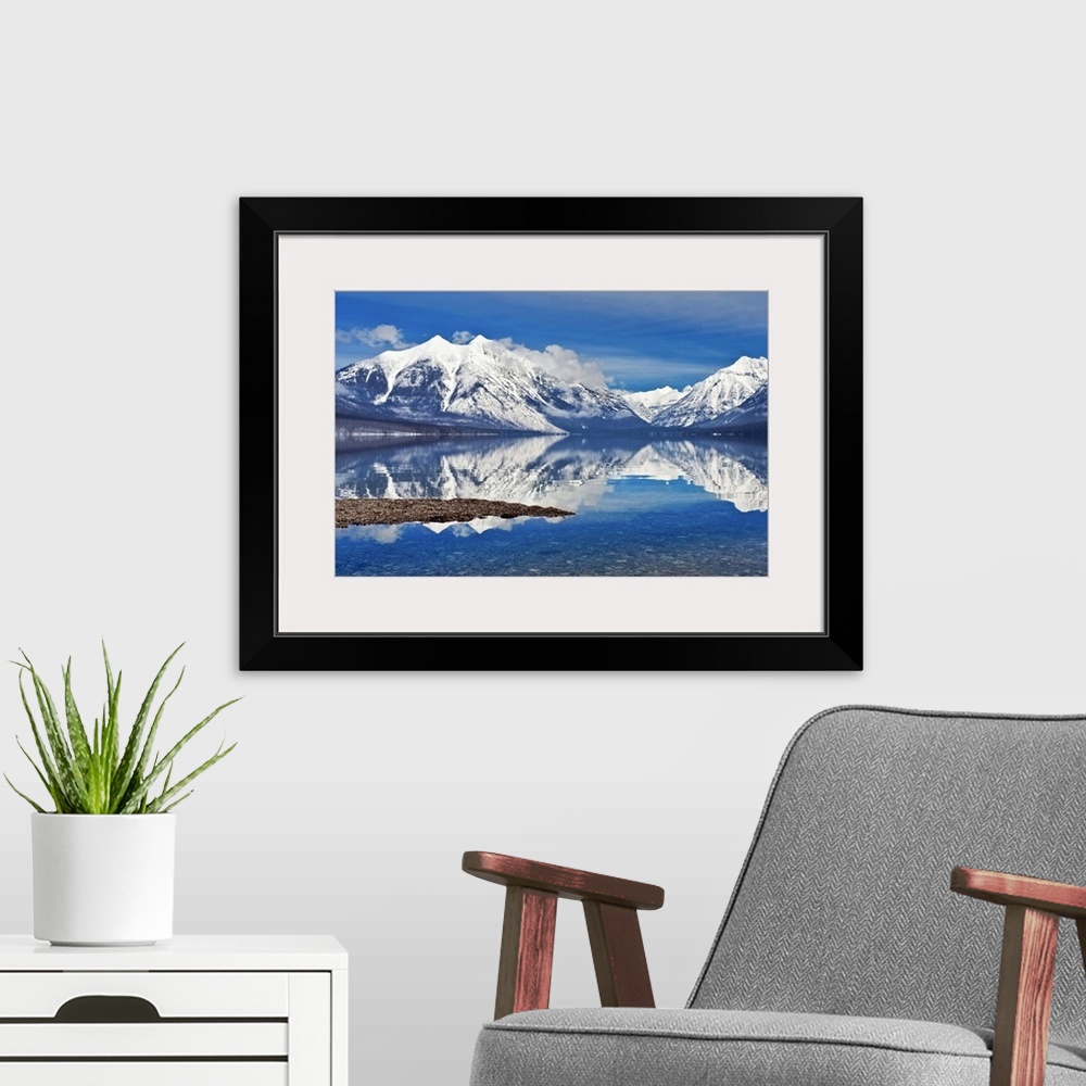 A modern room featuring Lake McDonald, Glacier national park as fog lifted.