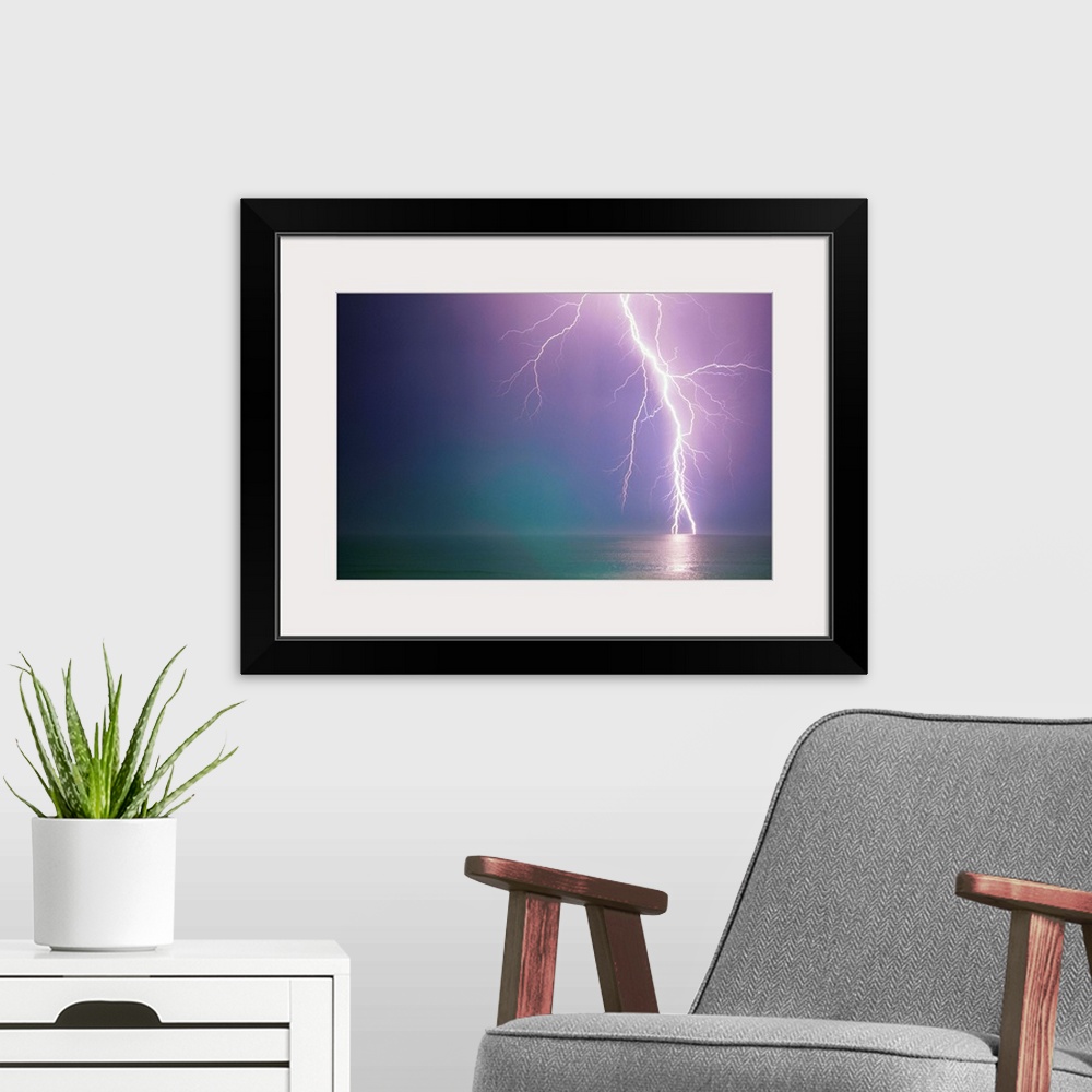 A modern room featuring Lightning Storm Over Ocean