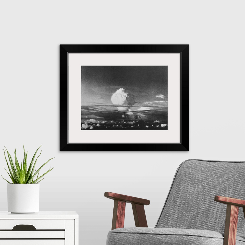 A modern room featuring The mushroom cloud from Ivy Mike, one of the largest nuclear blasts ever, during Operation IVY. T...