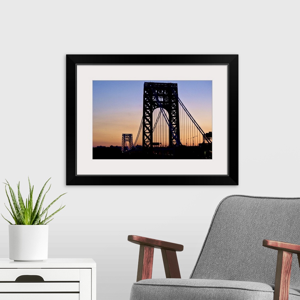 A modern room featuring Silhouette of George Washington Bridge at sunset.