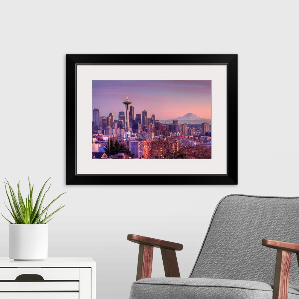 A modern room featuring Large photo on canvas of downtown Seattle bathed in warm light from a setting sun.