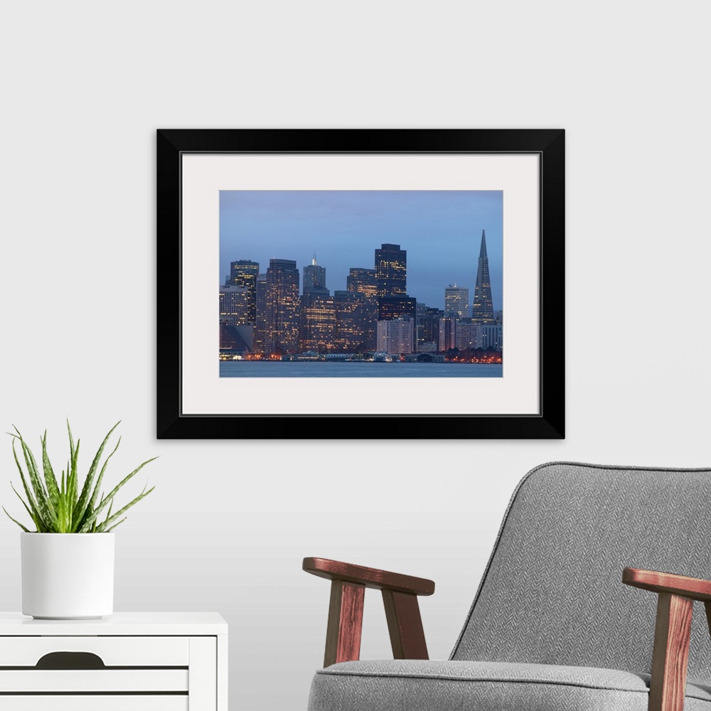 A modern room featuring USA, California, San Francisco city skyline, dusk