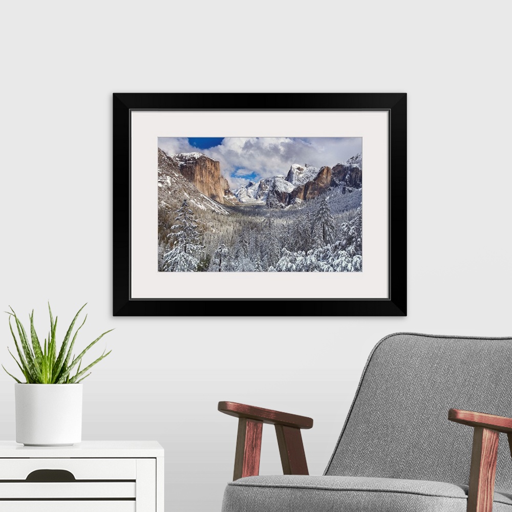 A modern room featuring Yosemite National Park, California after snow storm had dumped several inches for fresh snow on v...