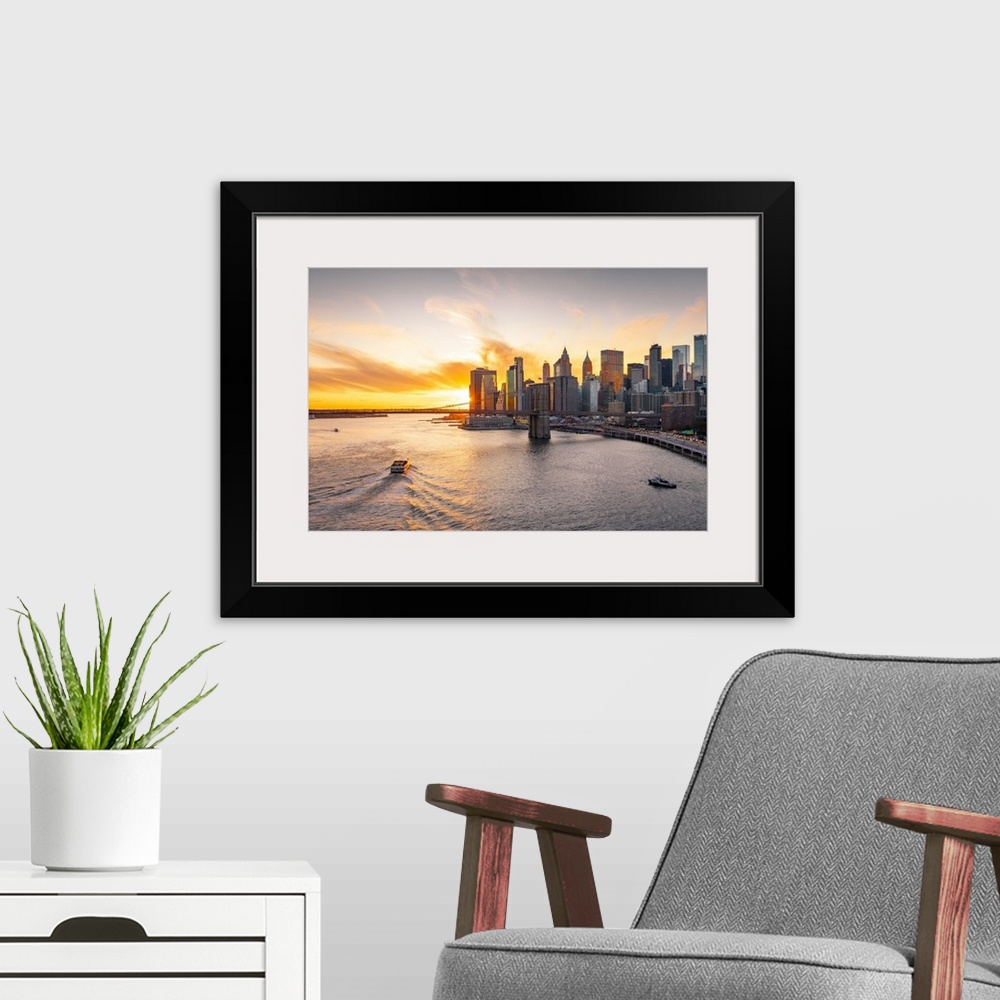 A modern room featuring A view of New York city and Brooklyn bridge from Manhattan Bridge. Manhattan, New York City, New ...