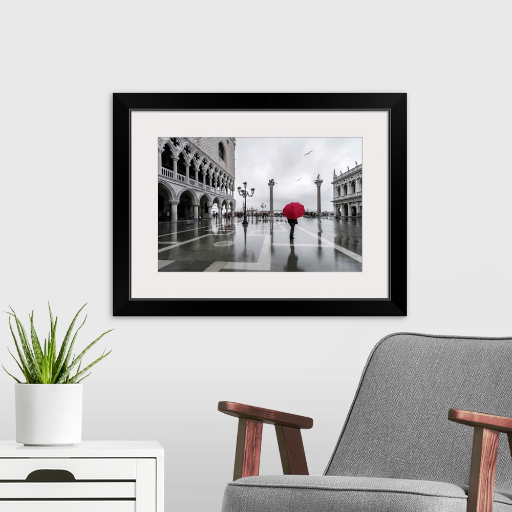 A modern room featuring Italy, Veneto, Venice. Woman with red umbrella in front of Doges palace with acqua alta (MR)