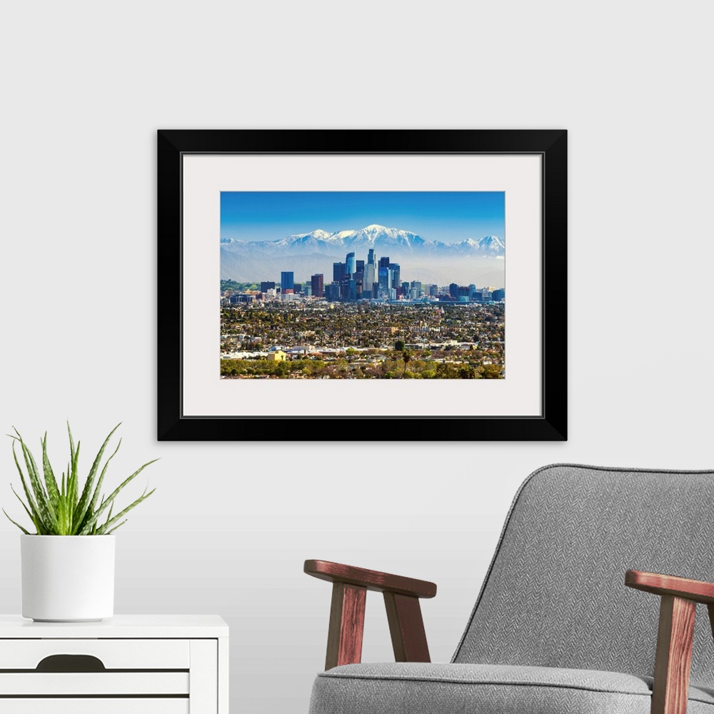 A modern room featuring Los Angeles Skyline And Snow Capped San Gabriel Mountains, California, USA