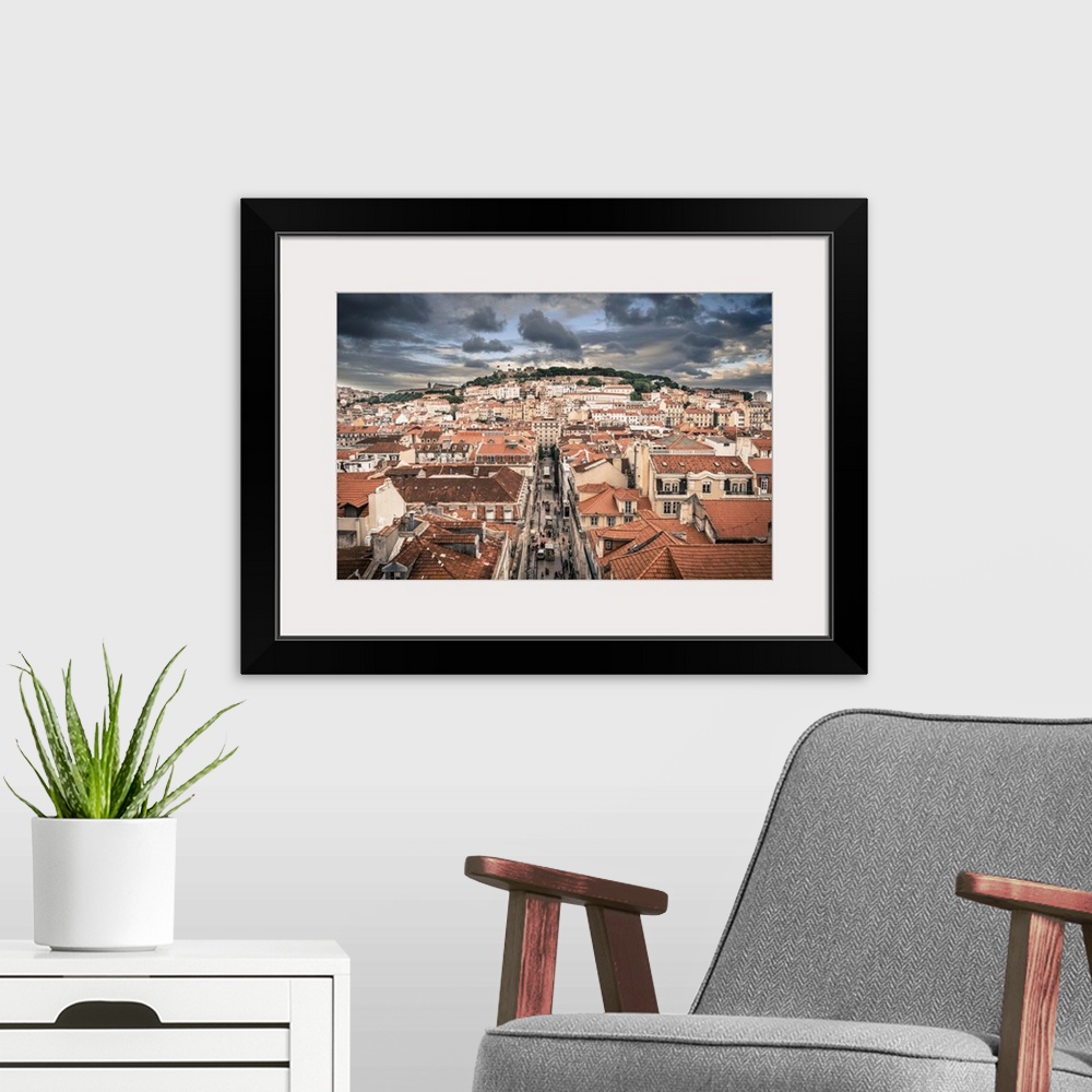 A modern room featuring Portugal, Lisbon, rooftop view of Baixa District with Sao Jorge Castle and Alfama District beyond