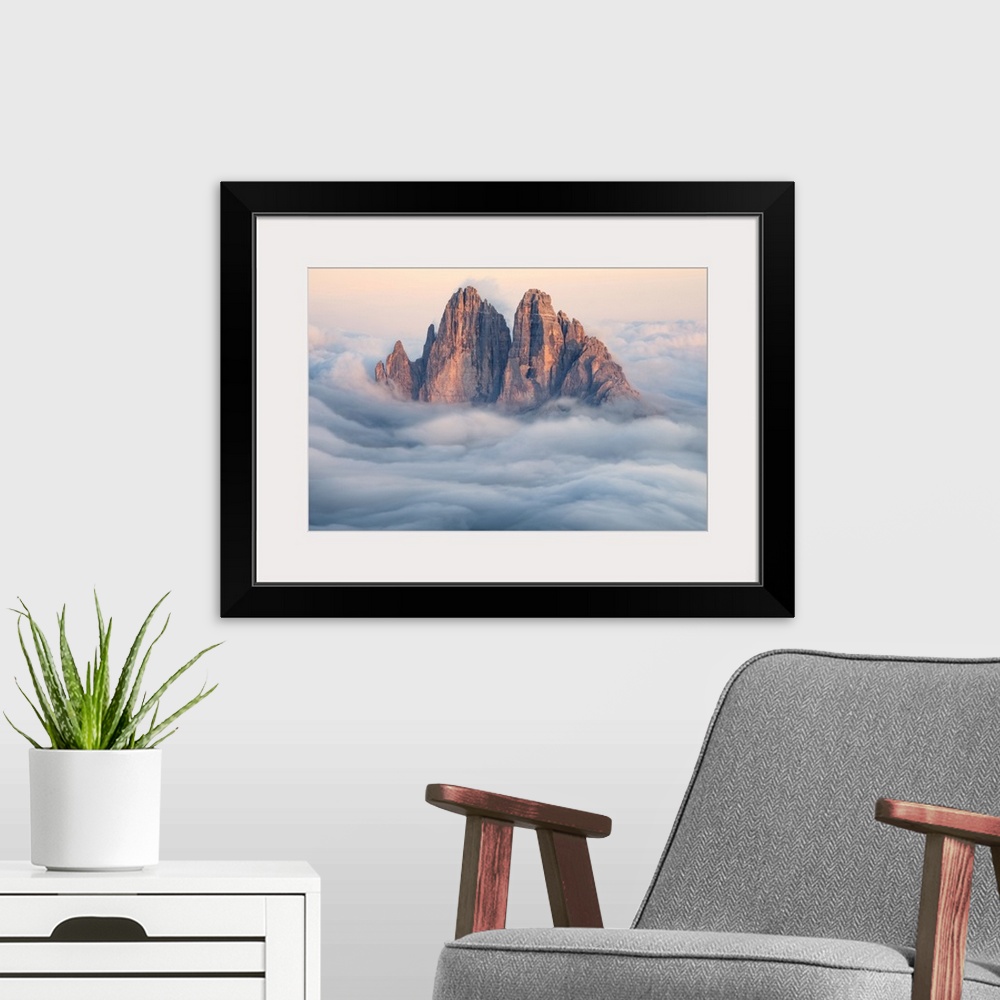 A modern room featuring Tre Cime di Lavaredo emerging from the clouds, Sexten Dolomites, South Tyrol, Bolzano, Italy, Europe