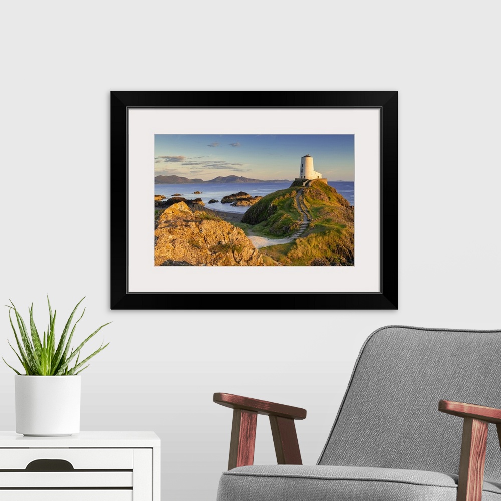 A modern room featuring Twr Mawr Lighthouse on Llanddwyn Island at Sunset, Anglesey, North Wales