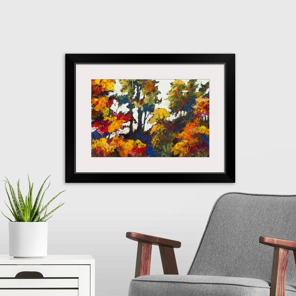 A modern room featuring Contemporary painting of a forest in autumn foliage.