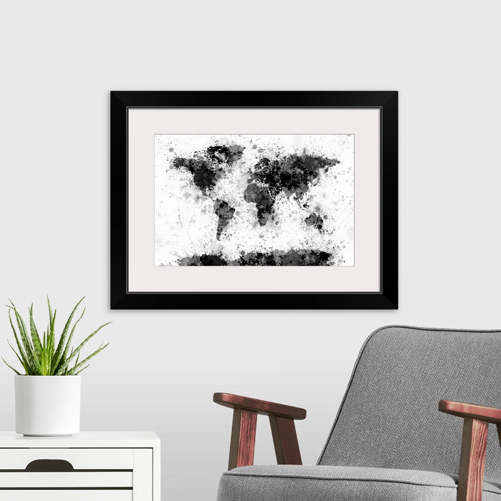 A modern room featuring Contemporary artwork of a world map made from black and gray toned paint splatters.