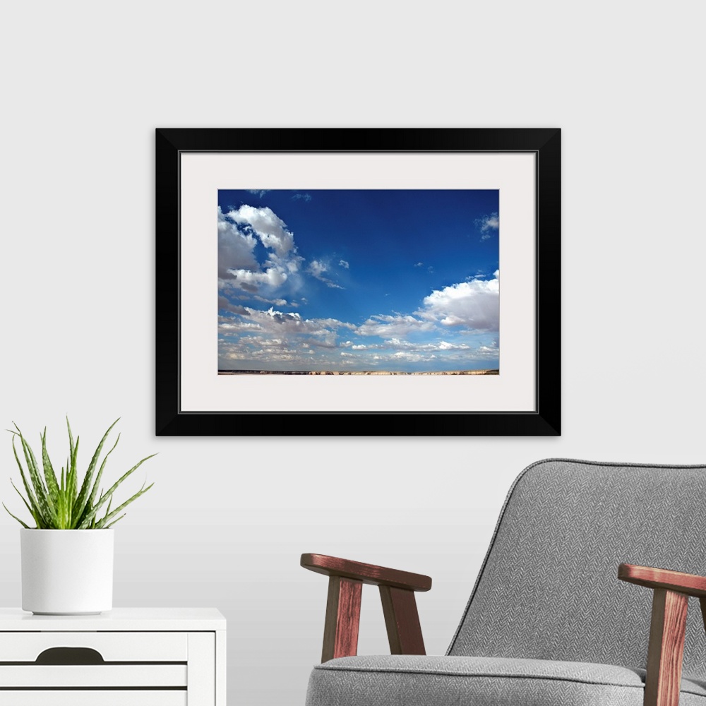 A modern room featuring Beautiful blue sky with heavy clouds