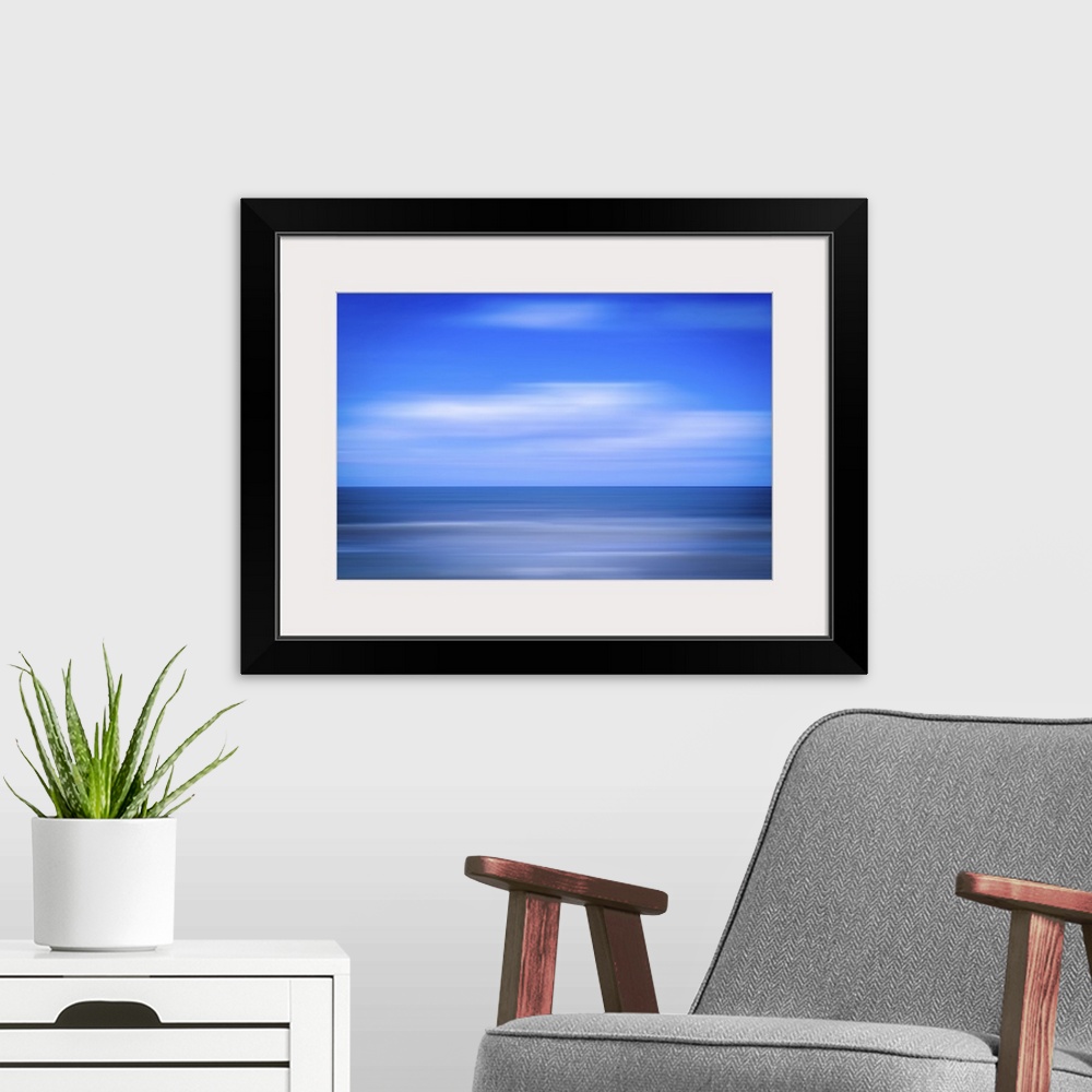 A modern room featuring An image of the sea using the ICM (Intentional Camera Movement) technique.