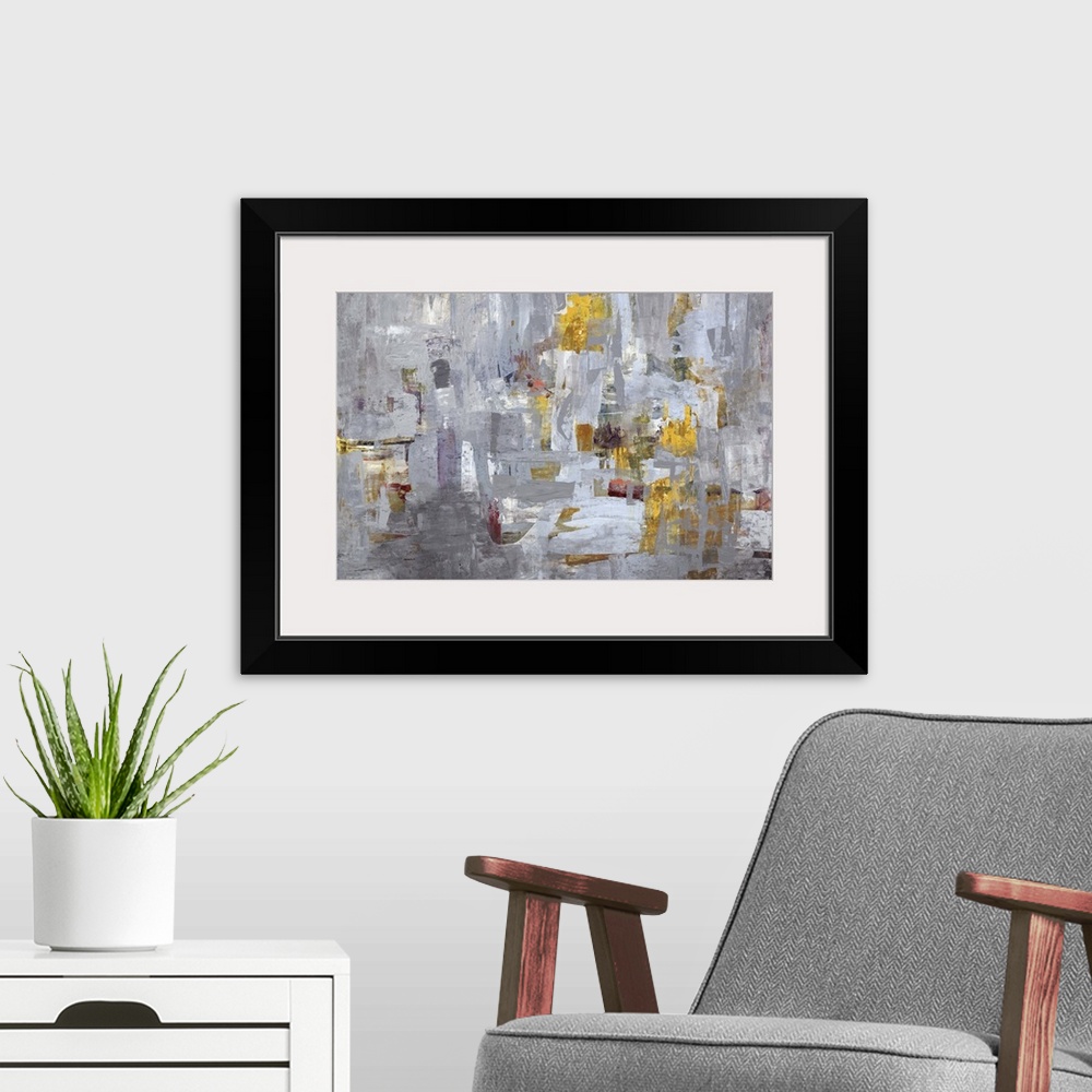 A modern room featuring Contemporary abstract painting using mostly gray tones with hints of gold.
