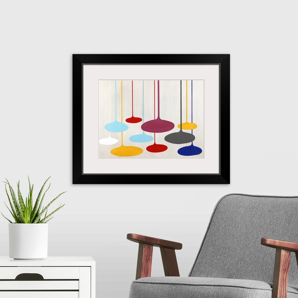A modern room featuring Contemporary artwork with retro shapes in bright primary colors.