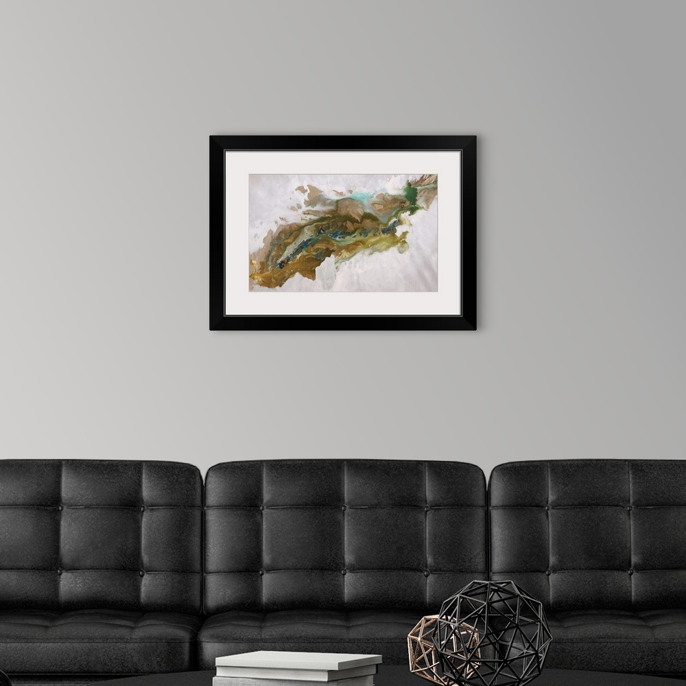 A modern room featuring Abstract painting of an aerial view over a deep, rocky canyon that run diagonally through the image.