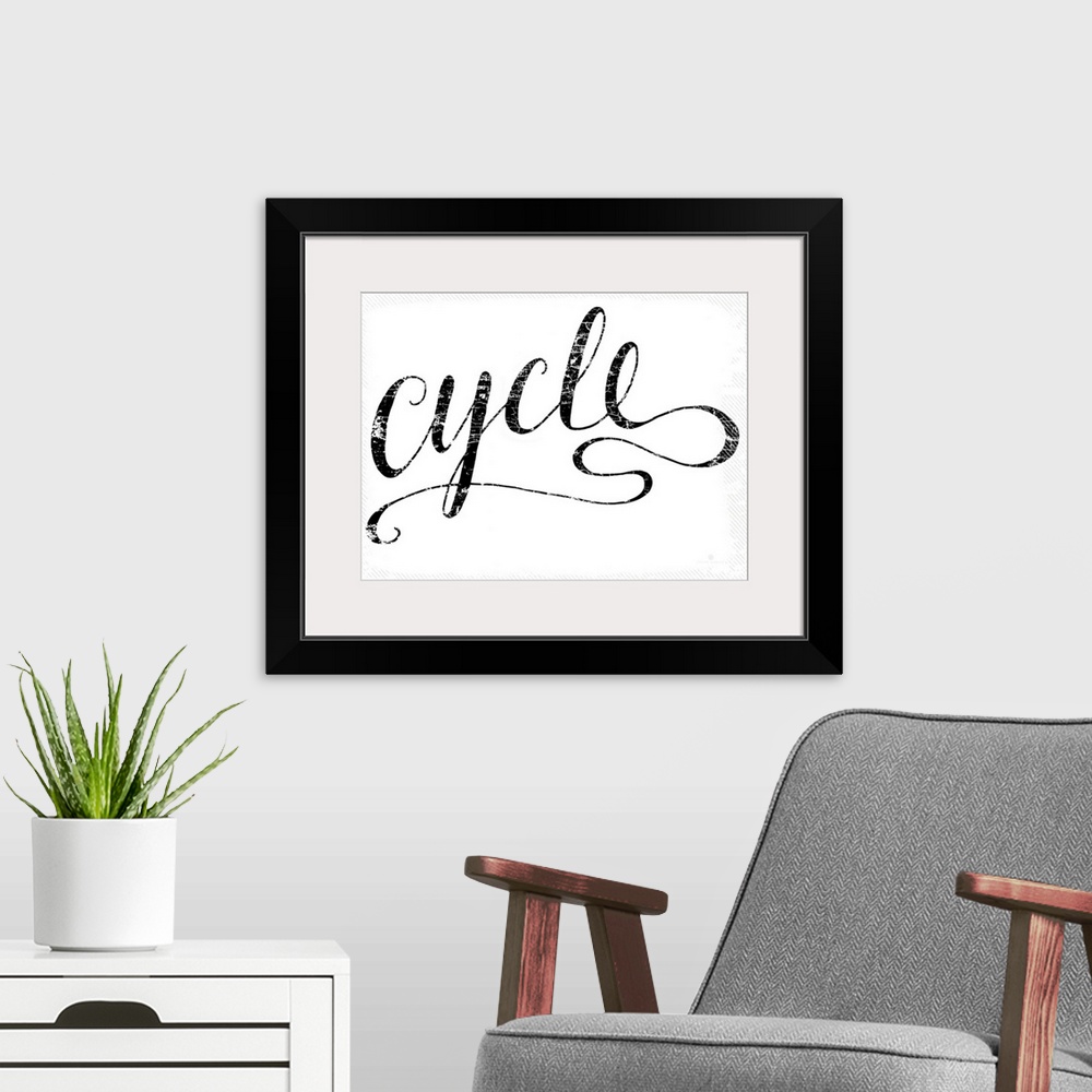 A modern room featuring Hand lettered script font of the word Cycle.