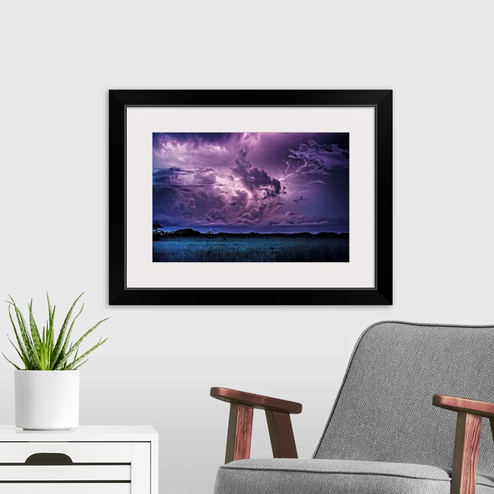 A modern room featuring Lightning storm over the Everglades at night.