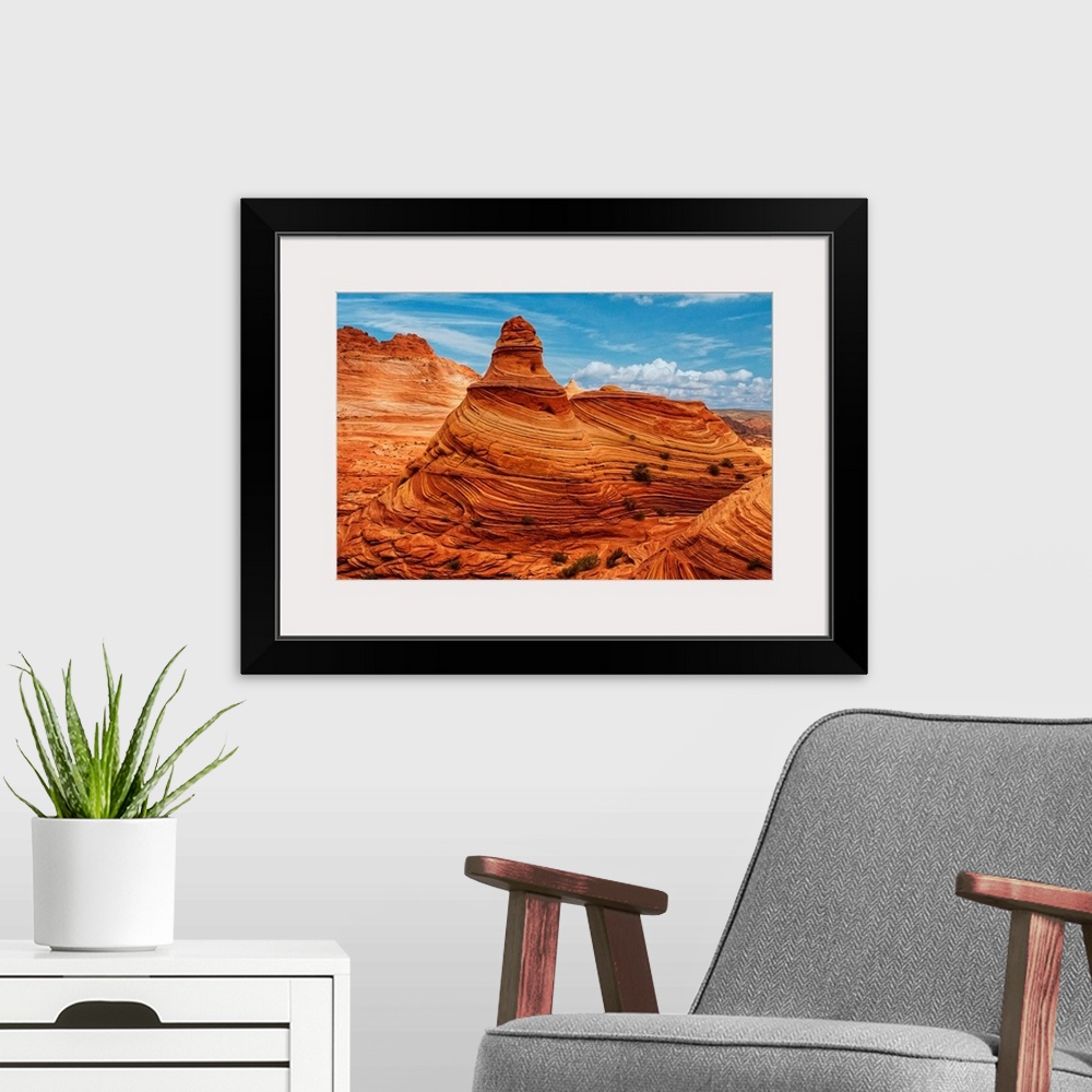 A modern room featuring A tall rock formation in the desert in Vermilion Cliffs, Arizona.