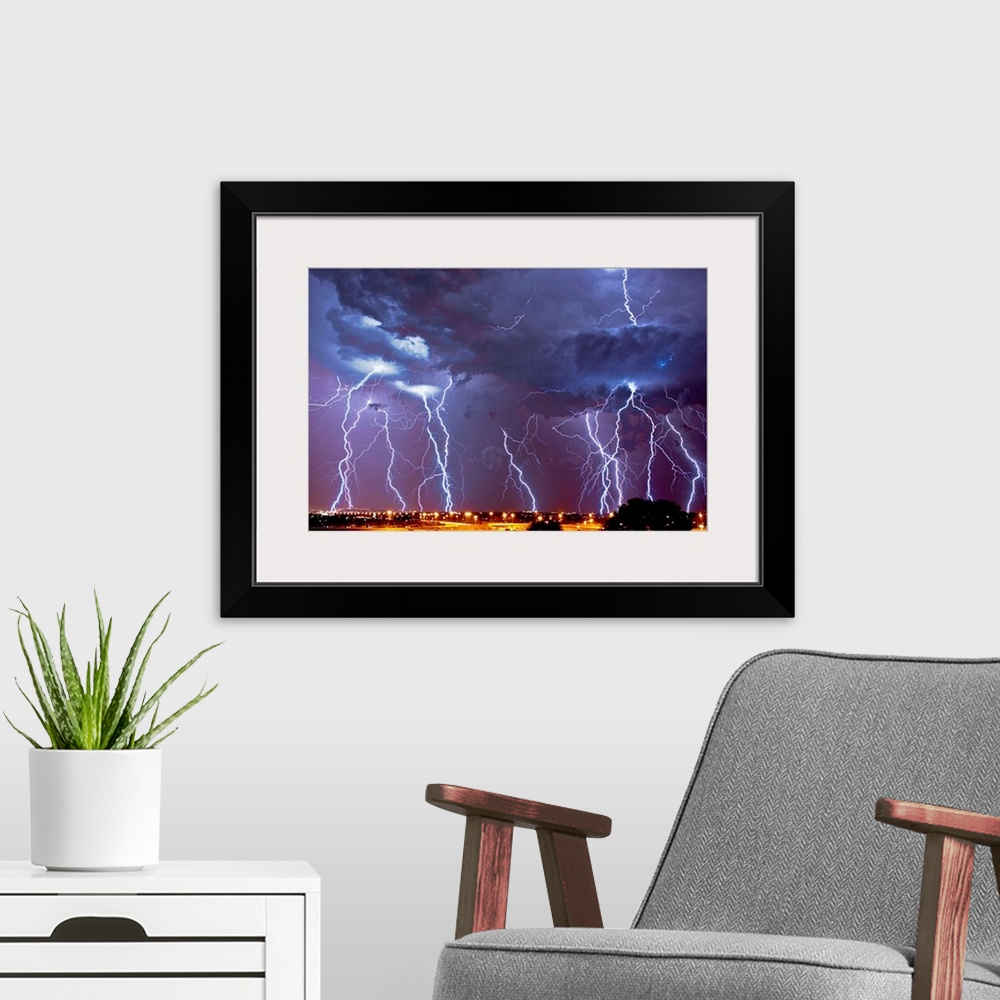 A modern room featuring Multiple exposures of a lightning storm over South Africa.