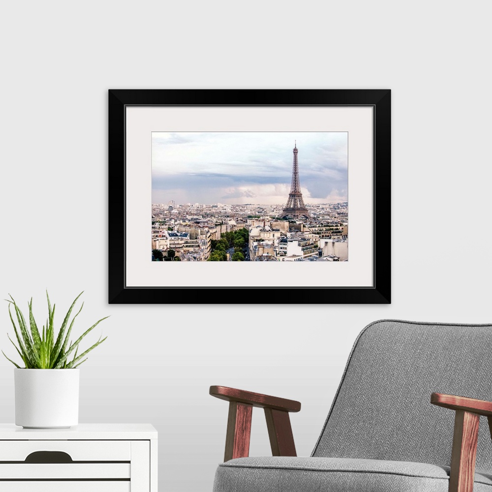 A modern room featuring Aerial photograph of a Paris cityscape with the Eiffel Tower towering over all the buildings.
