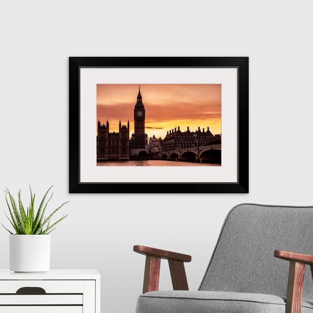 A modern room featuring View of Big Ben and Westminster Bridge at sunset in London, England.