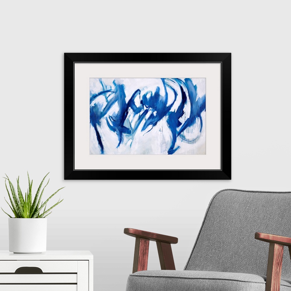 A modern room featuring Abstract painting of royal blue paint splashes and swipes as if to give the appearance of figures...