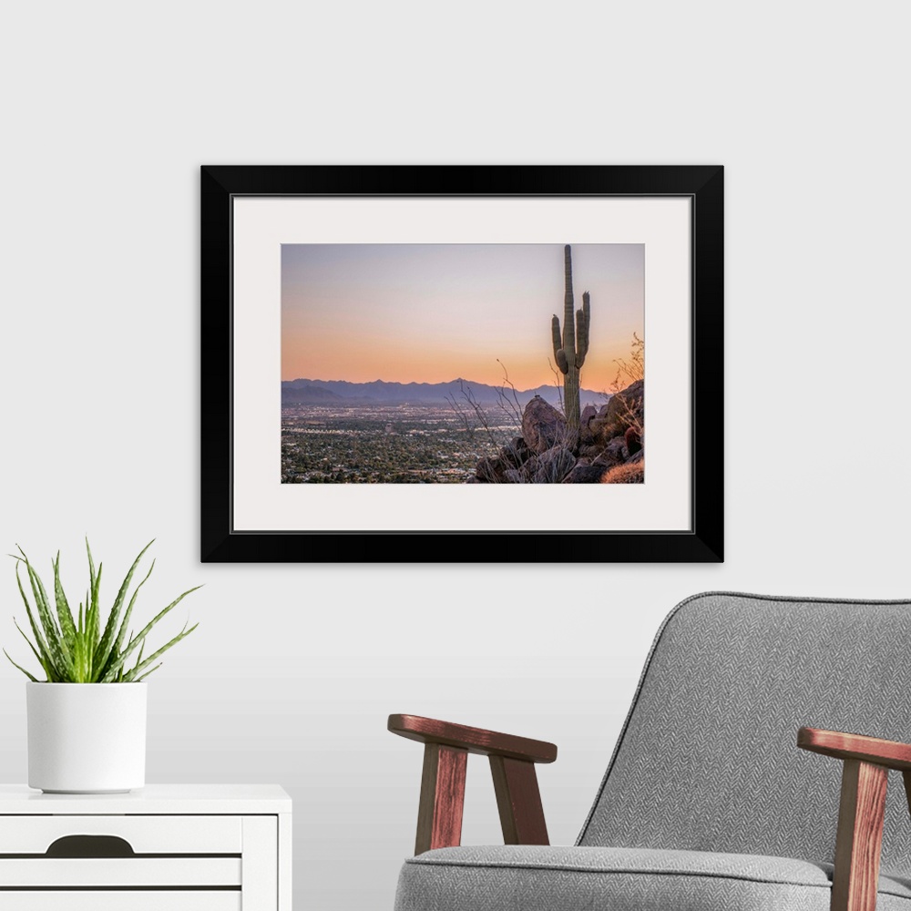 A modern room featuring Distant View Of Phoenix with a Saguaro Cactus, Arizona.