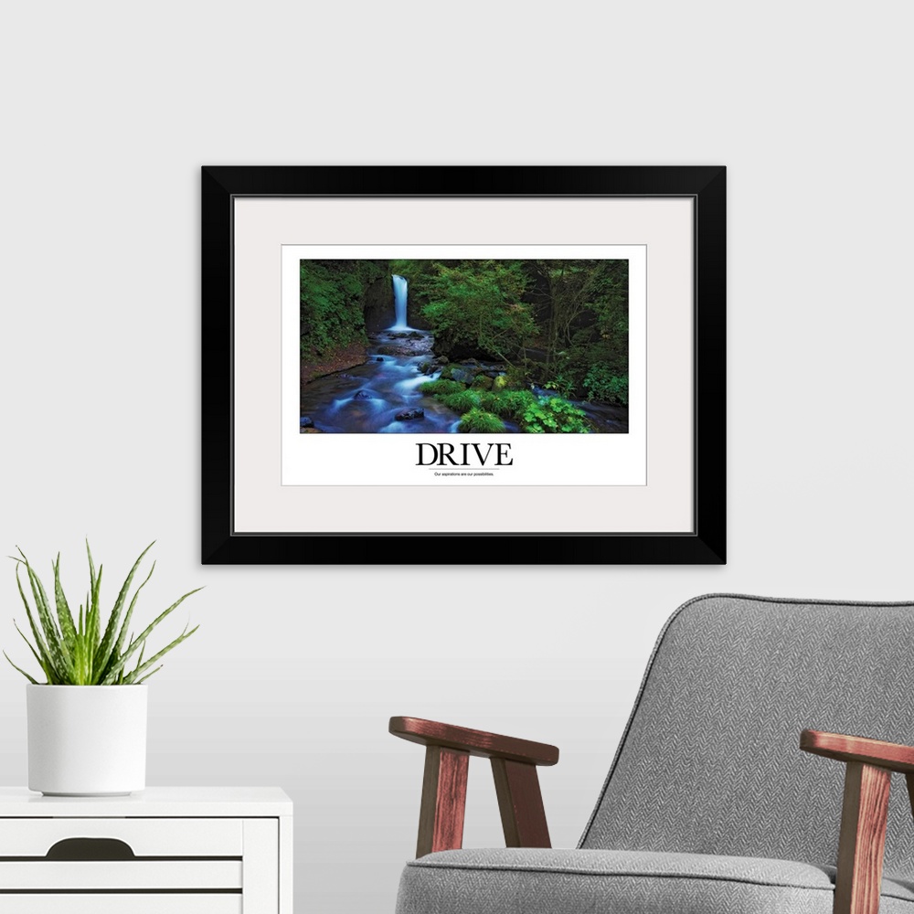 A modern room featuring A simple poster with a message of inspiration shows a waterfall and stream in a North American fo...