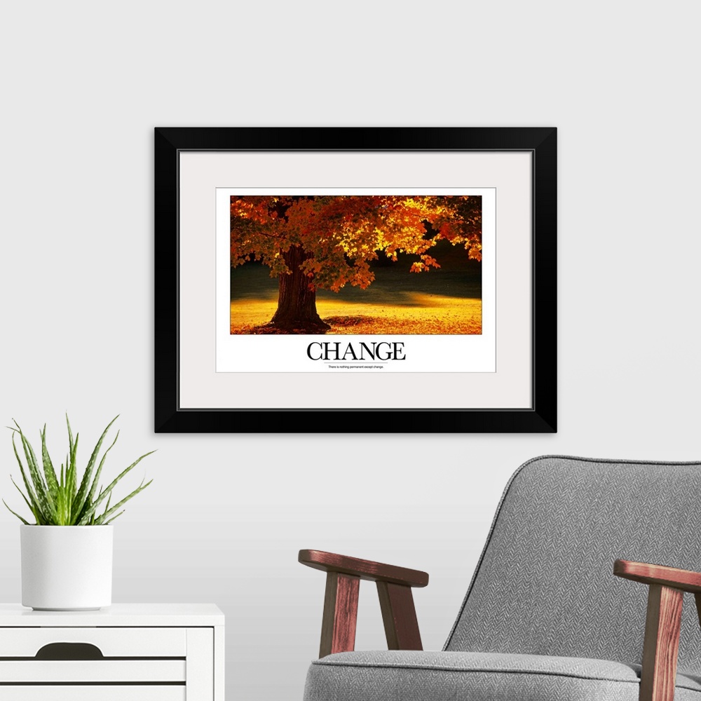 A modern room featuring Large inspirational wall art of an autumn tree full of colorful leaves and the word "Change" at t...