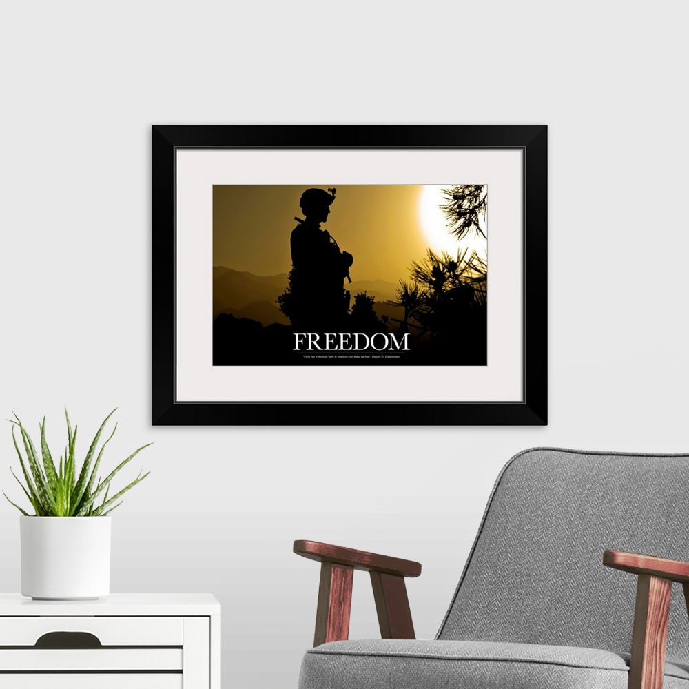 A modern room featuring Inspirational artwork for freedom showing the silhouette of a standing soldier created by the set...