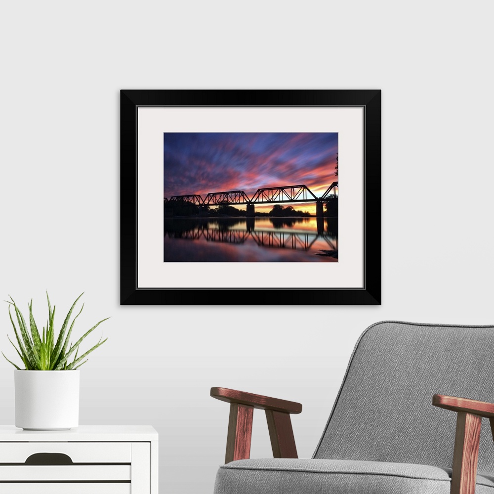 A modern room featuring Photograph of a bridge silhouette at sunset in Providence Metropark.