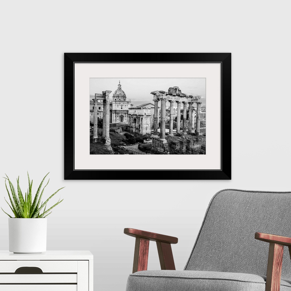 A modern room featuring Black and White photograph of the ruins at the Roman Forum.