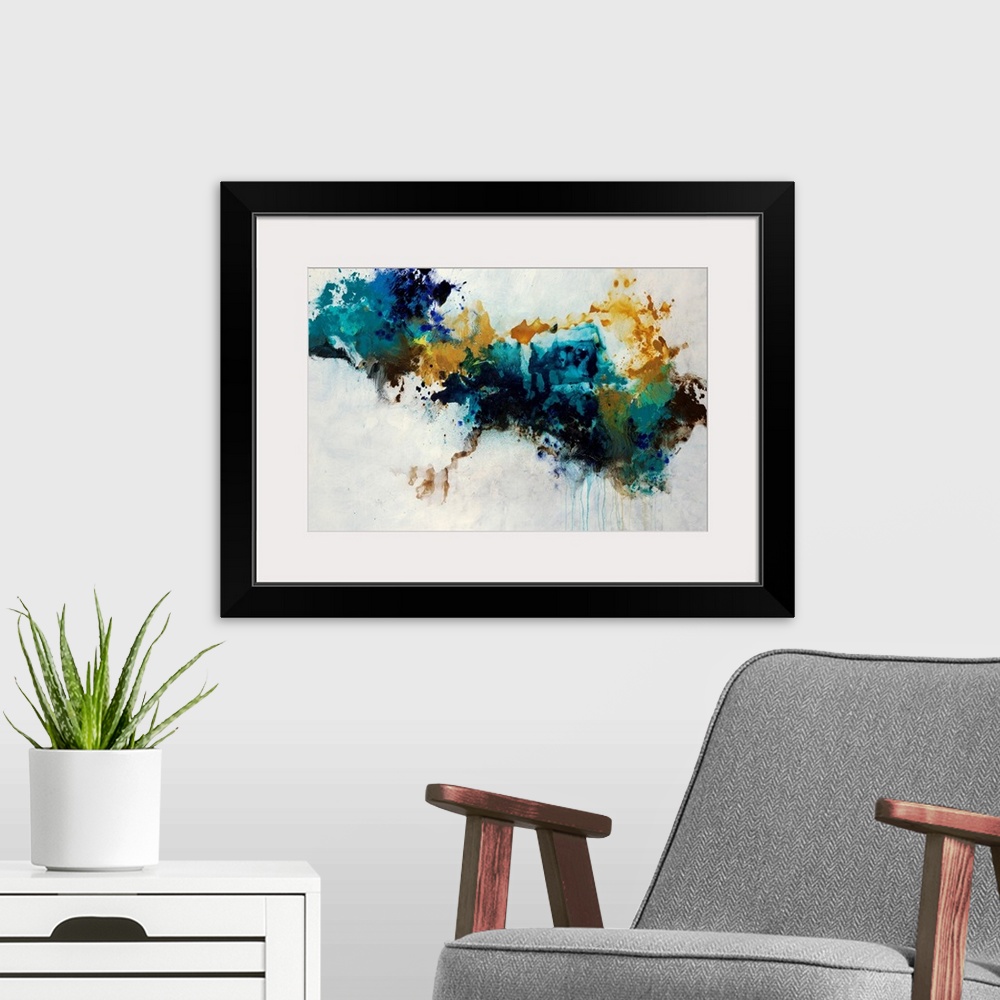 A modern room featuring Contemporary abstract painting of a huge splatter in teal, blue and golden yellow hues crossing t...