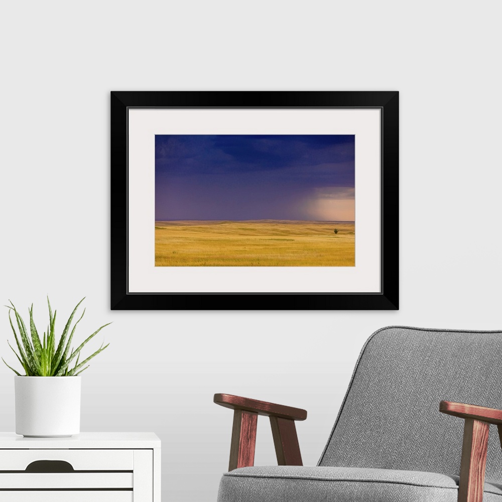 A modern room featuring Rolling plains against a dark stormy sky in the Badlands, South Dakota, United States of America,...