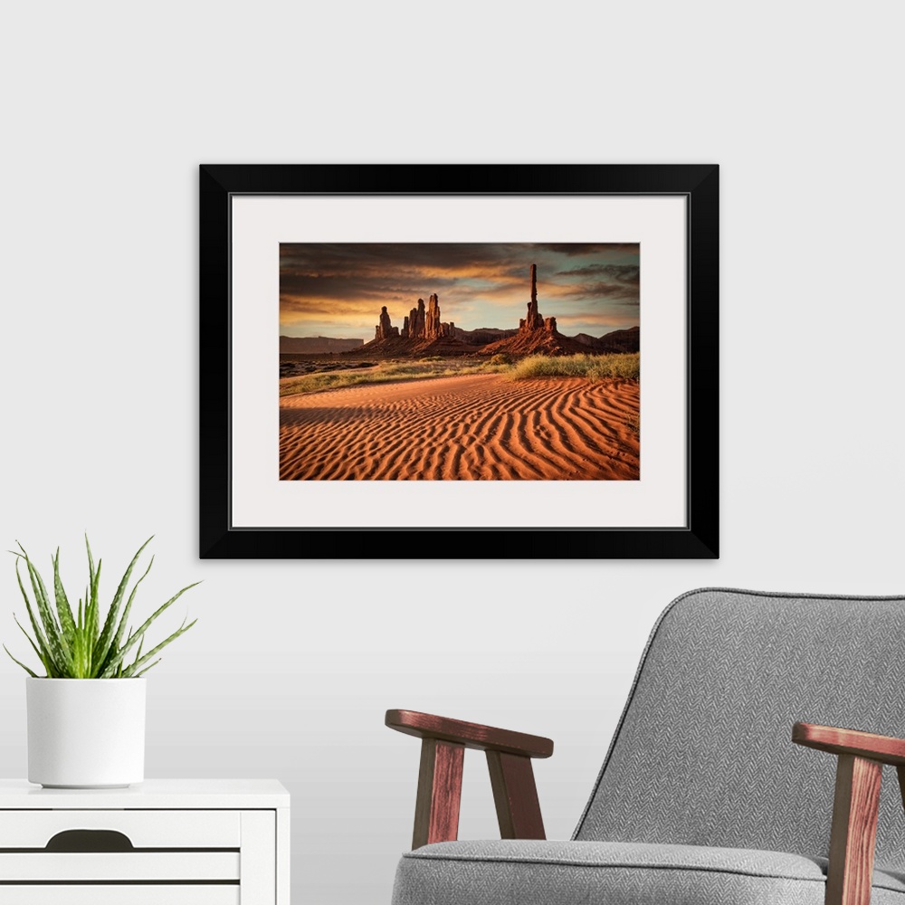 A modern room featuring Sunrise over Totem Pole in Monument Valley.