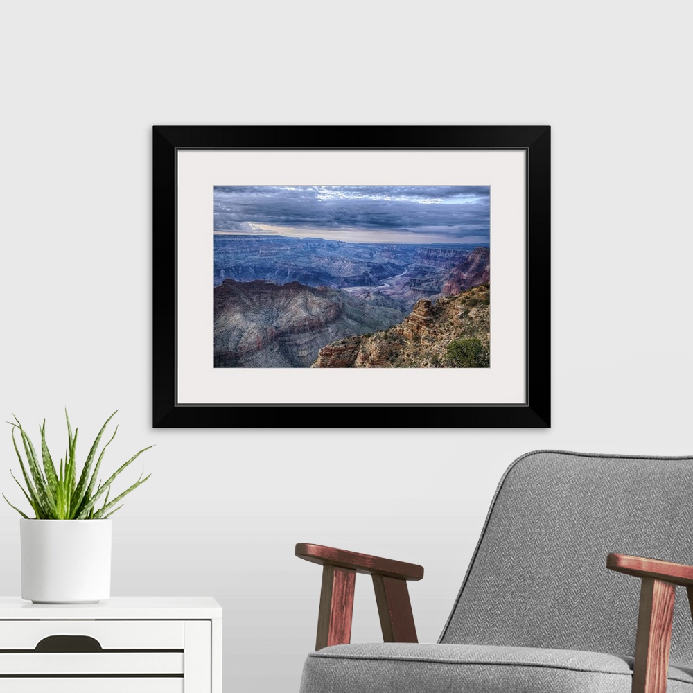 A modern room featuring The Grand Canyon at dusk