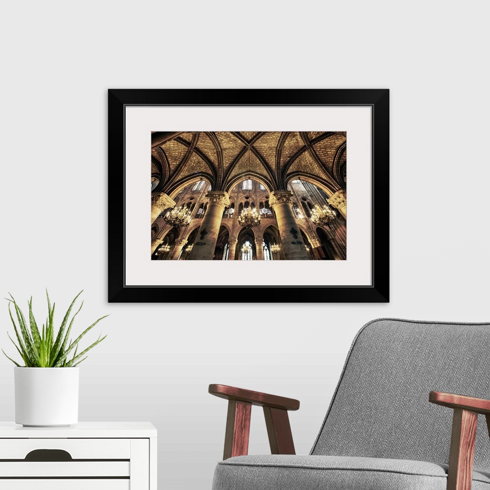 A modern room featuring This photograph is taken inside of the Notre Dame Cathedral looking up at the beautiful arch ceil...